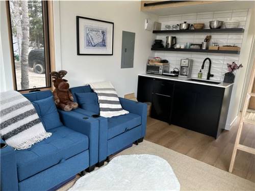 Chair and kitchenette in the rental