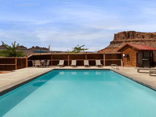 Pool with mountains in the view at Sun Outdoors Canyonlands Gateway