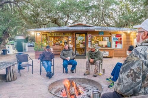 People sitting around a campfire