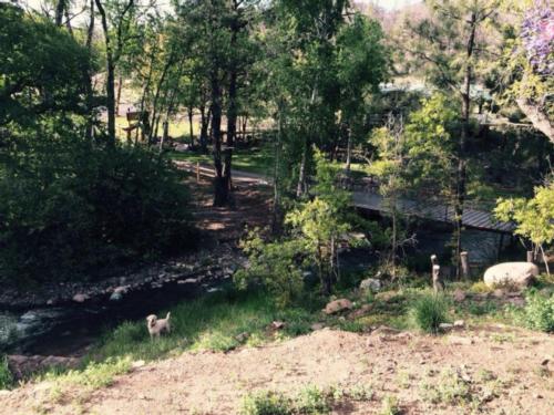 A bridge crossing the creek at Bonito Hollow RV Park & Campground