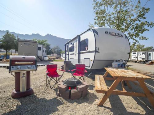 Parked trailer at site Moab RV & Glamping Resort