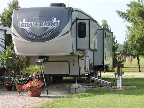 A fifth-wheel parked at a site