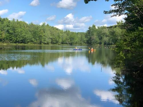 Lake with paddle boats at site Beaver Dam Campground