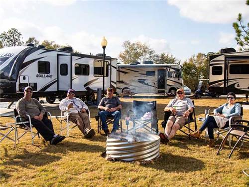 Campers gathered around a firepit